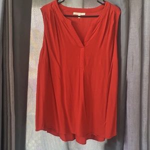 Burnt orange sleeveless blouse